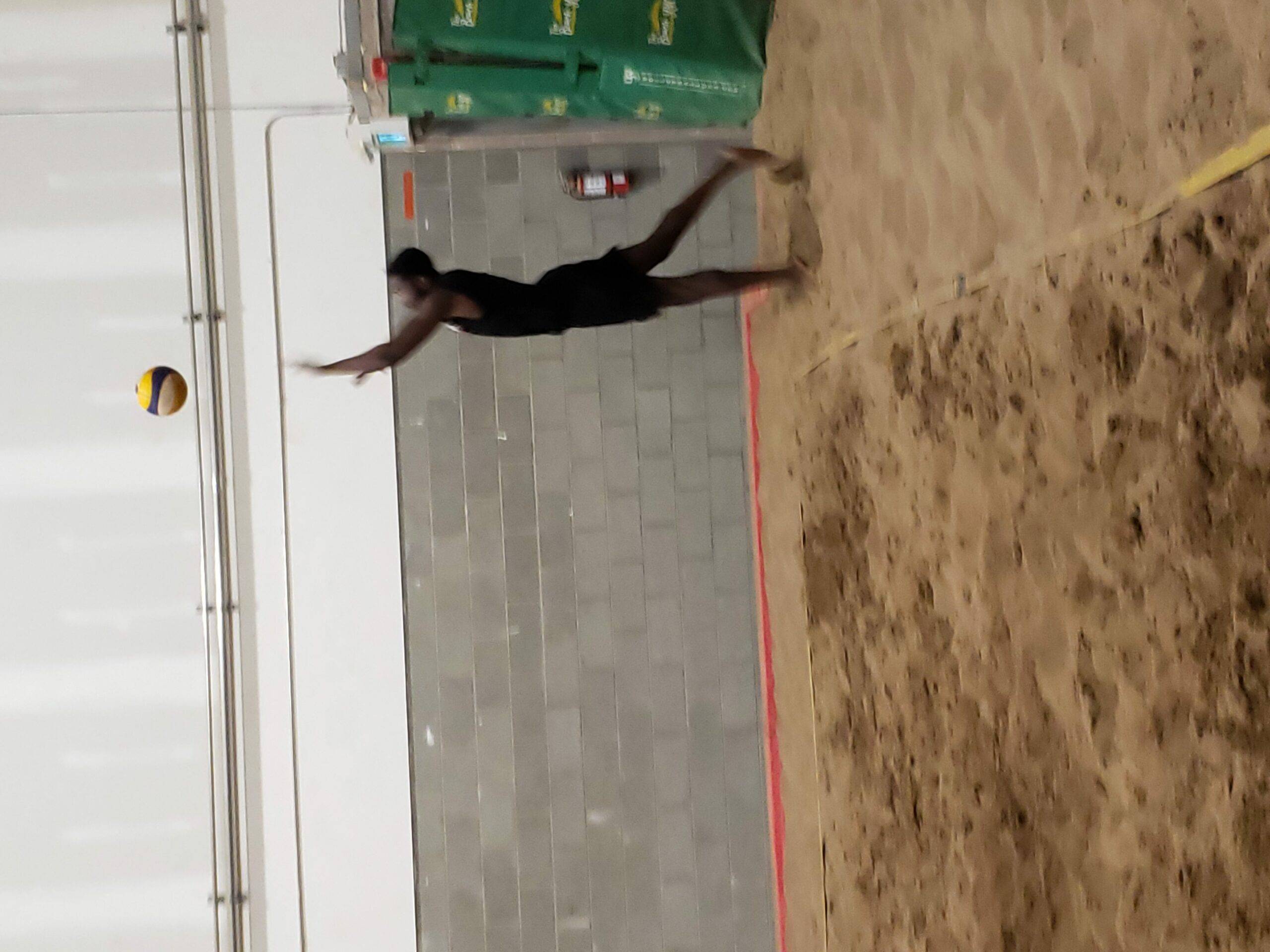 serving beach volleyball