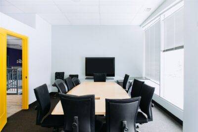 image of a boardroom with a large table 